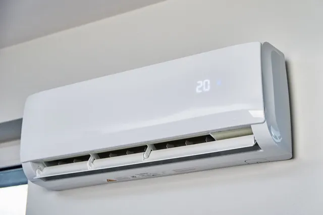 A white, wall-mounted air conditioning unit displaying the number 20 on its front panel.